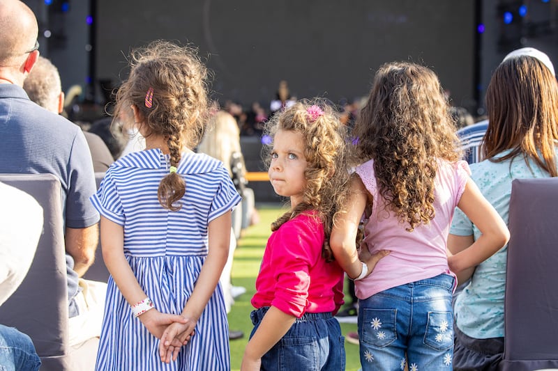 Children enjoy the performance.