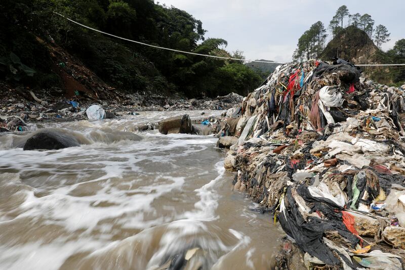 Mountains of waste on the banks of the Las Vacas river in Guatemala. Reuters