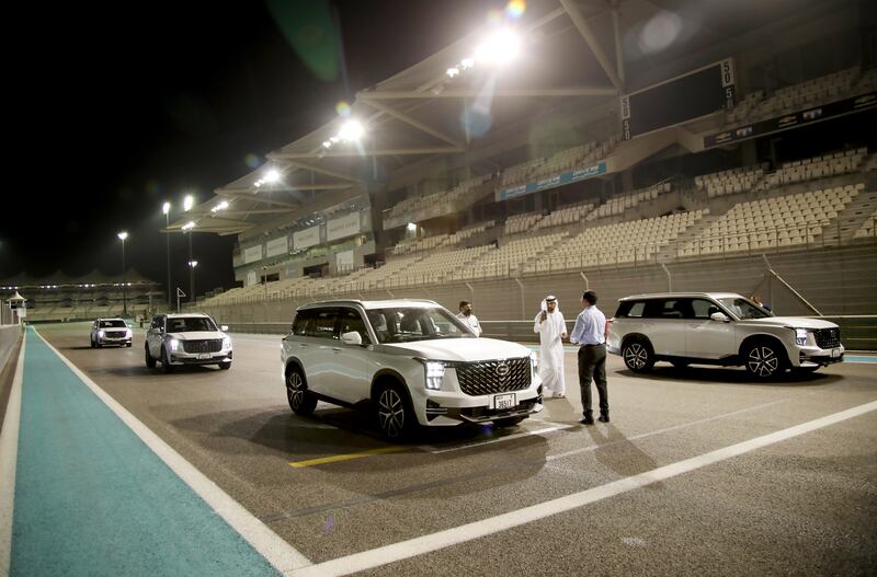 Participants prepare themselves for a GS8 test drive at Yas Marina Circuit.