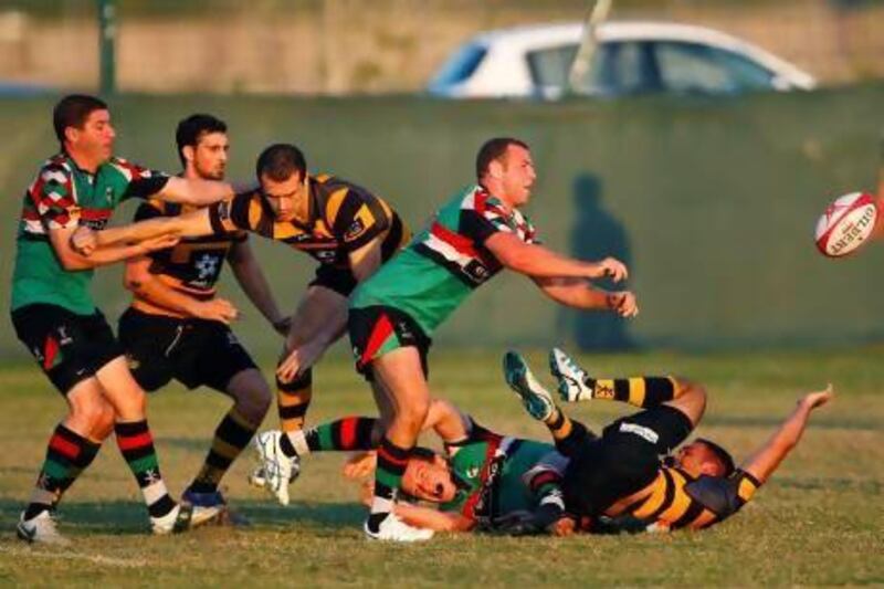Ben Bolger, of Abu Dhabi Harlequins, centre, spent plenty of time during the team's opening-round rugby league match talking his inexperienced colleagues through the rudiments of the game. Jake Badger for The National