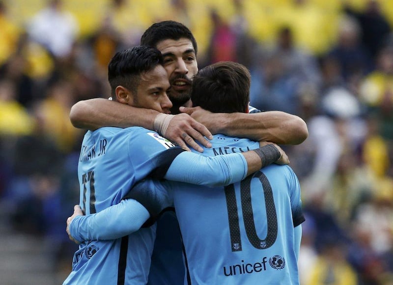 Barcelona stars Luis Suarez, centre, Neymar and Lionel Messi celebrate a goal in a La Liga match in February. Juan Medina / Reuters