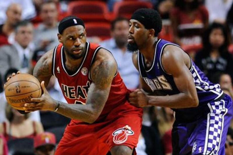 Sacremento's John Salmons tries to prevent LeBron James from passing him.