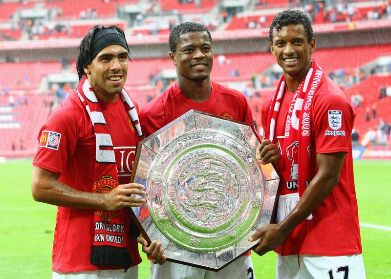LONDON - AUGUST 10:  (R-L) Luis Nani, Patrice Evra and Carlos Tevez of Manchester United celebrate with the trophy as they are victorious on penalty kicks during the FA Community Shield match between Manchester United and Portsmouth at Wembley Stadium on August 10, 2008 in London, England.  (Photo by Phil Cole/Getty Images)