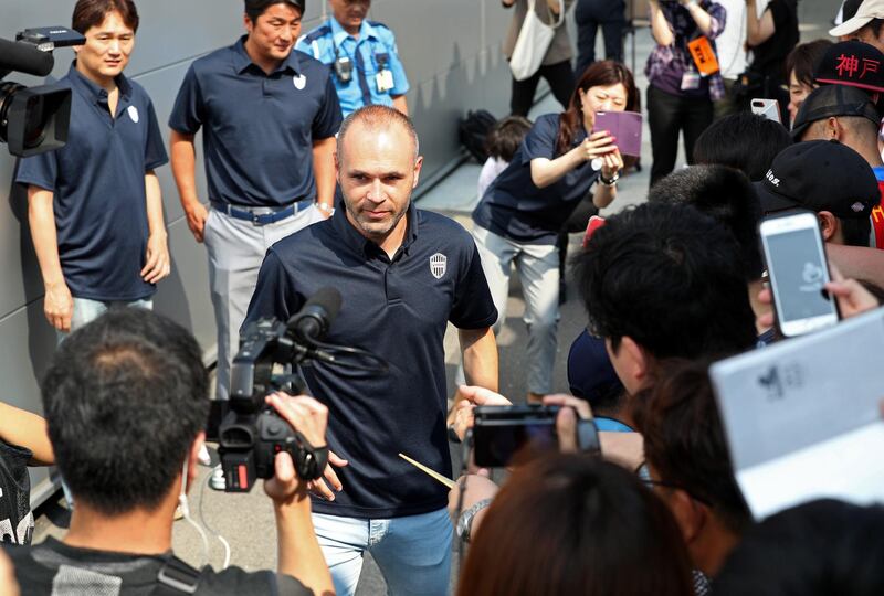Spanish football player Andres Iniesta is surrounded by Japanese fans upon his arrival at Kansai International Airport in Izumisano, Osaka, Japan, on July 18, 2018. Jiji Press / EPA
