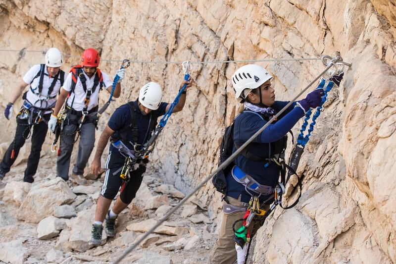 The region’s first commercial Via Ferrata and UAE's largest outdoor zip line was put to the test when the CEO of Ras Al Khaimah Tourism Development Authority, Haitham Mattar, and Emirati adventurers Huda Zowayed and Hamad Al Mazrouey climbed, trekked and zip-lined the challenge set against the backdrop of Ras Al Khaimah’s Jebel Jais, the UAE’s highest mountain peak. Photo Credit Action PR Group *** Local Caption ***  bz24no-Rak-02.jpg