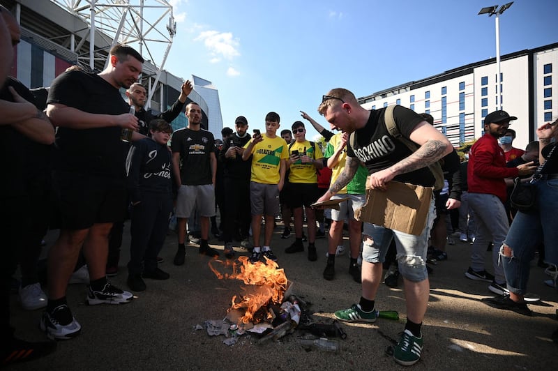 Supporters protest against Manchester United's owners outside Old Trafford stadium. AFP
