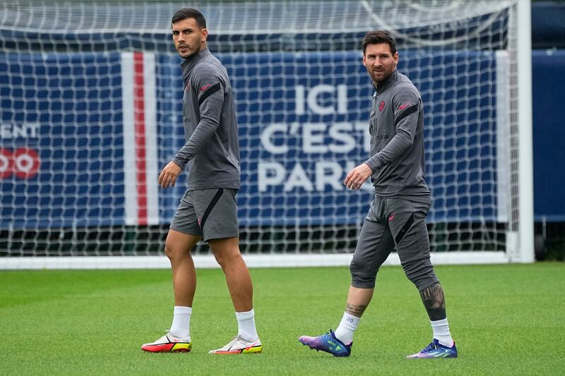 Lionel Messi with Leandro Paredes during training session in Saint Germain-en-Laye, west of Paris., on Monday. AP
