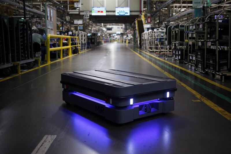 A Mobile Industrial Robots (MiR) automated guided vehicle (AGV) moves along the Camry sedan assembly line at the Toyota Motor Corp. manufacturing plant in Georgetown, Kentucky, U.S., on Thursday, Aug. 29, 2019. Retrofitting a Camry sedan assembly line for the RAV4 SUV is part of a company mandate to update Toyota's oldest North American plant with newer technology, more efficient processes, and fresher products. Photographer: Luke Sharrett/Bloomberg