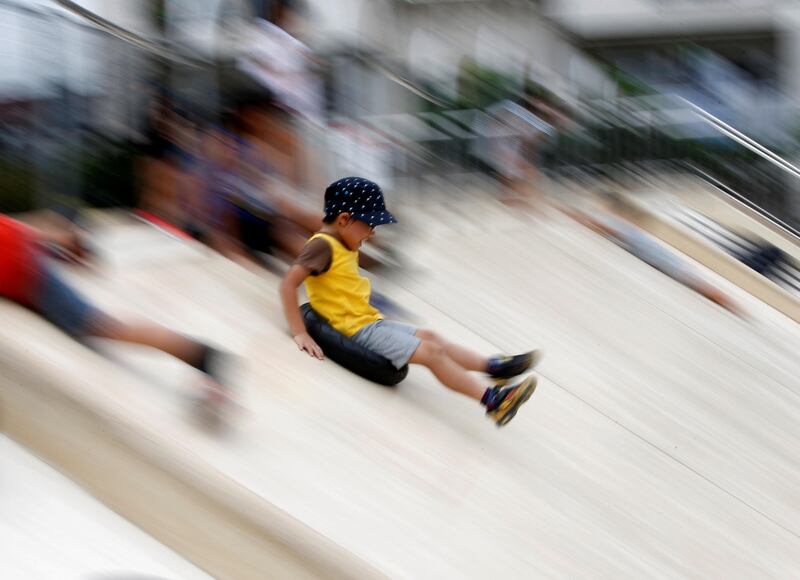 A boy rides on a slide with a tire at Nishi Rokugo Park, also known as the Tire Park, at Ota-Ku, in Tokyo, Japan. The park was built recycling thousands of old tires. KKim Kyung-Hoon / Reuters.