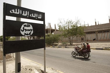 An Al Qaeda logo on a street sign in the town of Jaar in Yemen’s southern Abyan province, in 2012. AP