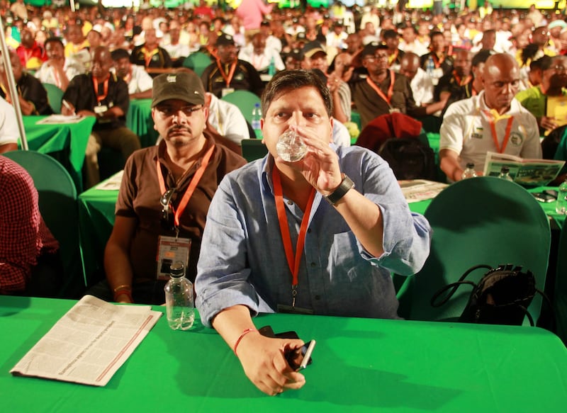 Rajesh Gupta and Atul Gupta at an African National Congress (ANC) event in December 2012. Simphiwe Nkwali / Sunday Times / Getty Images
