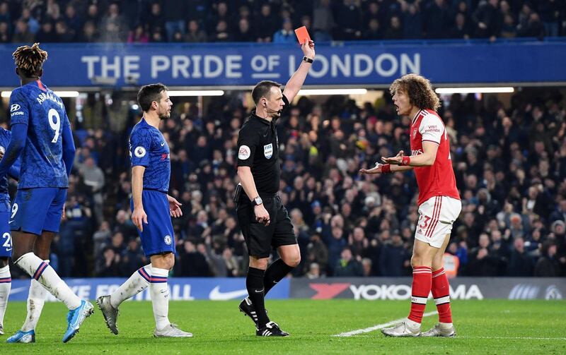 David Luiz of Arsenal is shown the red card by referee Stuart Attwell at Stamford Bridge. EPA