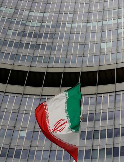 FILE PHOTO: An Iranian flag flutters in front of the International Atomic Energy Agency (IAEA) headquarters in Vienna, Austria, September 9, 2019.  REUTERS/Leonhard Foeger/File Photo