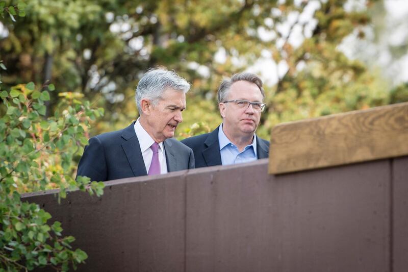 Jerome Powell, chairman of the U.S. Federal Reserve, left, speaks with John Williams, president and chief executive officer of the Federal Reserve Bank of New York, during the Jackson Hole economic symposium, sponsored by the Federal Reserve Bank of Kansas City, in Moran, Wyoming, U.S., on Friday, Aug. 24, 2018. While Powell said U.S. productivity has been low for a decade or longer, his comments suggest he would want to accommodate with low interest rates any rise in efficiency across the American economy. Photographer: David Paul Morris/Bloomberg