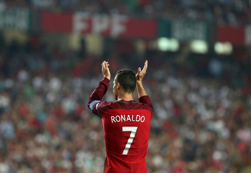 Portugal's Cristiano Ronaldo celebrates at the end of the World Cup Group B qualifying soccer match between Portugal and Switzerland at the Luz stadium in Lisbon, Tuesday, Oct. 10, 2017. (AP Photo/Armando Franca)