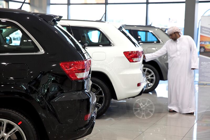 Abu Dhabi, United Arab Emirates, May 27, 2013: 
A potential customer checks out the latest models of Jeep SUVs as he shops around for a car on Monday, May 27, 2013, at the Emirates Motor Company showroom on Airport Road in Abu Dhabi.
Silvia Razgova / The National

