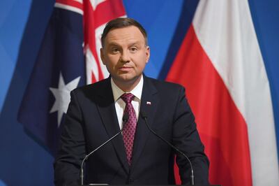 FILE - In this Aug. 21, 2018, file photo, Polish President Andrzej Duda speaks at the Conference of Energy Cooperation in Sydney, during his state visit to Australia.  During a visit to New Zealand, Polish President Andrzej Duda on Wednesday, Aug. 22,  defended the moves his nation's government have made to take control of the judicial system. Poland's conservative government lowered the retirement age for Supreme Court judges from 70 to 65 as part of a broader judicial overhaul which has put it in conflict with the European Union. Poland's Supreme Court this month suspended implementation of the legislation, which would force more than one-third of the court's justices to retire. (Dean Lewins/Pool Photo via AP, File)