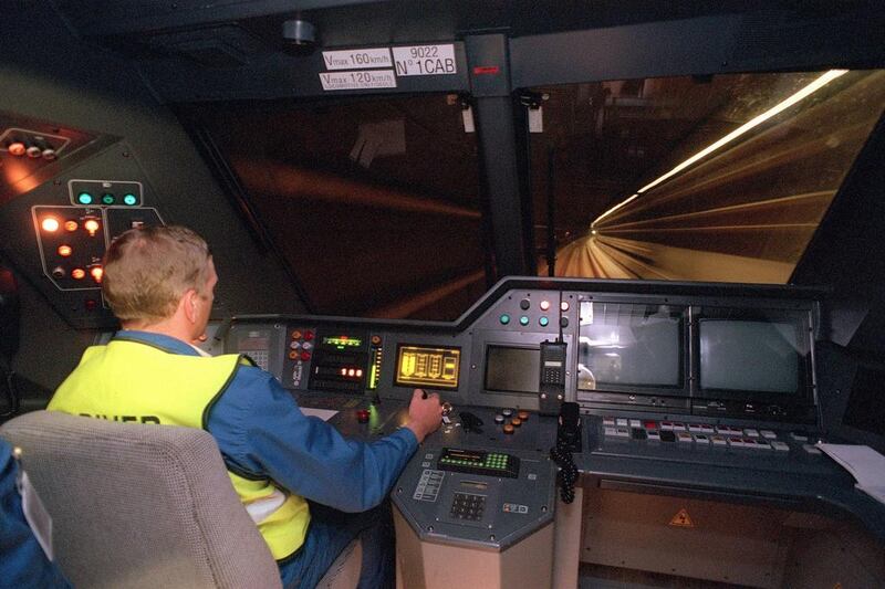 A machinist drives a trans-channel shuttle during a technical trial run on May 6, 1994. Up to 400 trains pass through the tunnel each day, carrying an average of 50,000 passengers, 6,000 cars, 180 coaches and 54,000 tonnes of freight. Jacques Demarthon / AFP