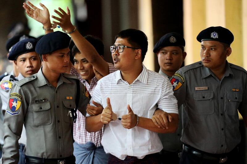 Detained Reuters journalists Wa Lone and Kyaw Soe Oo arrive at Insein court in Yangon, Myanmar August 27, 2018. REUTERS/Ann Wang