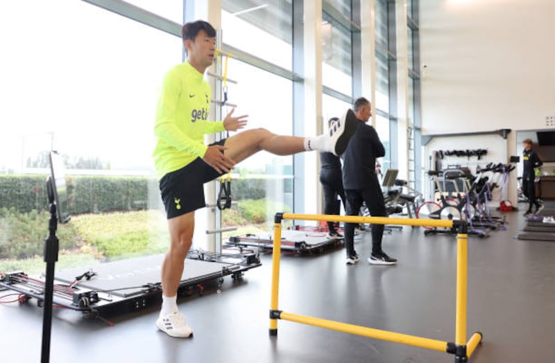 Son Heung-min doing stretching exercises. Getty Images
