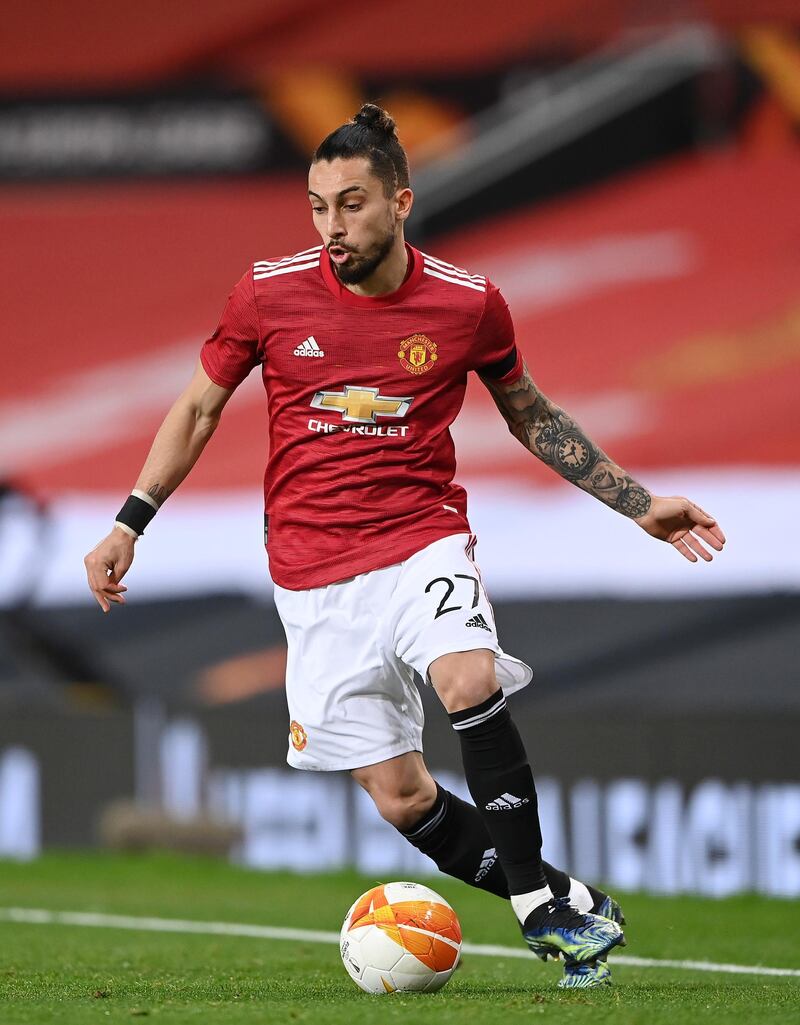 MANCHESTER, ENGLAND - FEBRUARY 25: Alex Telles of Manchester United runs with the ball during the UEFA Europa League Round of 32 match between Manchester United and Real Sociedad at  on February 25, 2021 in Manchester, England. Sporting stadiums around the UK remain under strict restrictions due to the Coronavirus Pandemic as Government social distancing laws prohibit fans inside venues resulting in games being played behind closed doors. (Photo by Laurence Griffiths/Getty Images)