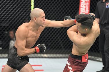 Brian Ortega punches Jung Chan-sung in their featherweight bout during the UFC Fight Night inside Flash Forum on UFC Fight Island in Abu Dhabi. Josh Hedges/Zuffa LLC 