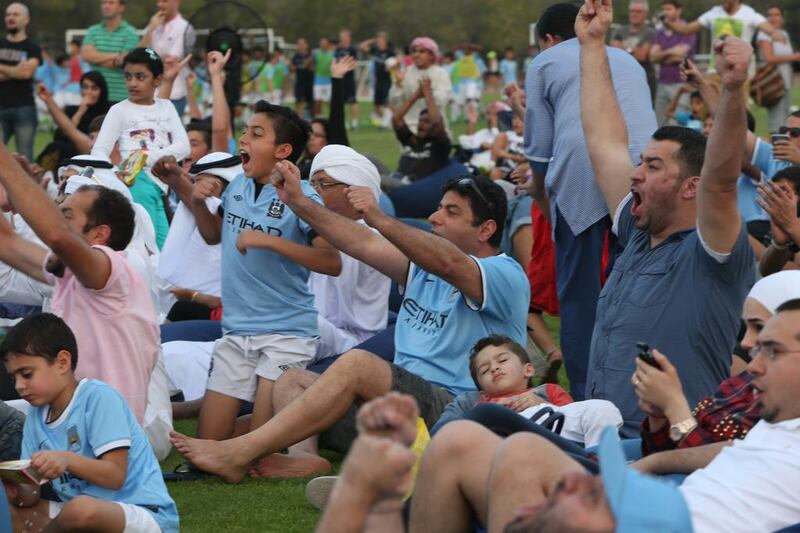 There were varying degrees of excitement at the free outdoor screening of the decider between Manchester City and West Ham, but those who stayed awake celebrated energetically. Fatima Al Marzooqi / The National