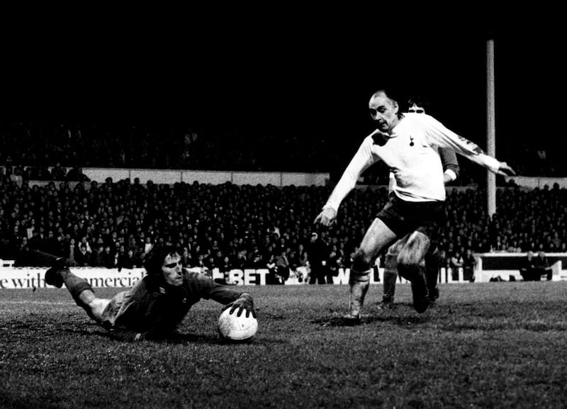 File photo dated 06-01-1972 - Liverpool goalkeeper Ray Clemence dives at the feet of Tottenham Hotspur's Alan Gilzean. PA Photo