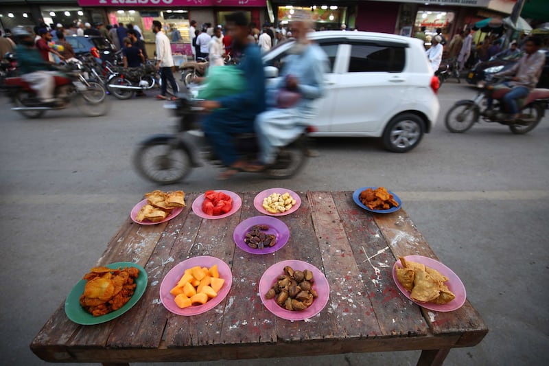 A table is set as people wait to break their fast during Ramadan, in Karachi, Pakistan, in March 2023. EPA