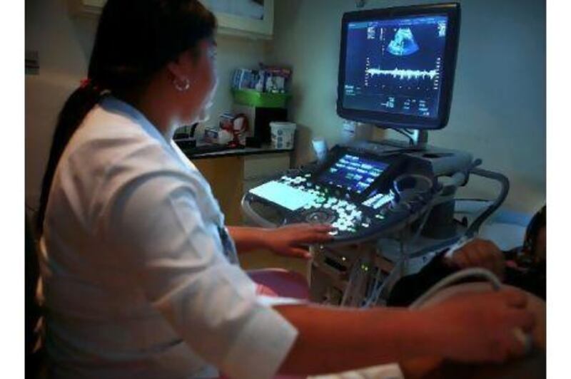 A woman gets an ultrasound of her unborn baby at the Corniche Hospital. The hospital will be launching a preconception programme next year to help get women more health conscious before they are pregnant.