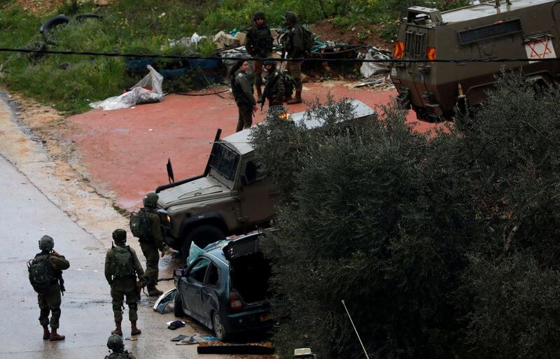 Israeli forces gather at the scene of an incident near Ramallah, in the Israeli-occupied West Bank. Reuters