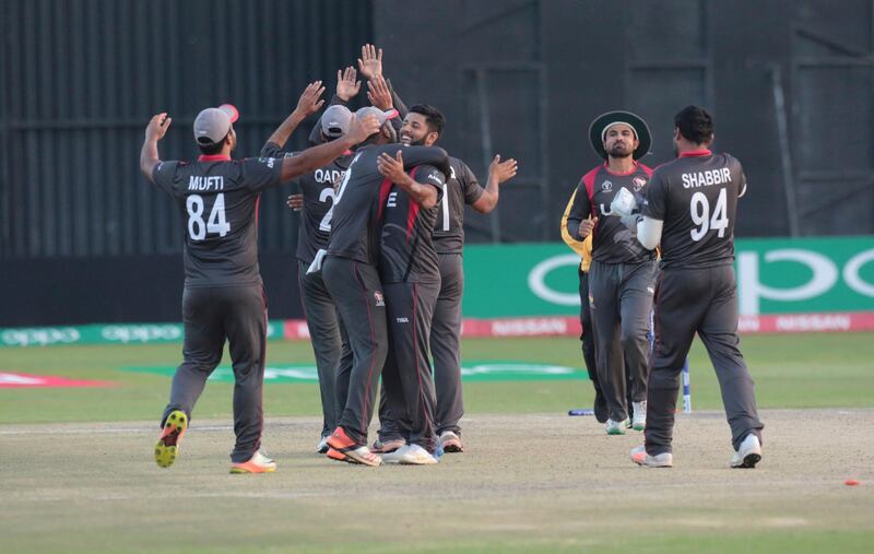 UAE players celebrate after winning their cricket world cup qualifier match against Zimbabwe at Harare Sports Club, Thursday, March, 22, 2018. Zimbabwe is playing host to the 2018 Cricket World Cup Qualifier matches featuring 10 countries. (AP Photo/Tsvangirayi Mukwazhi)