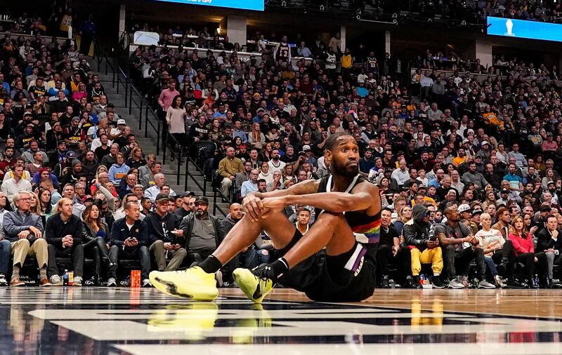 Denver Nuggets guard Will Barton sits on the court, hoping for a foul call during their home NBA defeat against the Los Angeles Lakers on Tuesday, December 3, 2019. AP