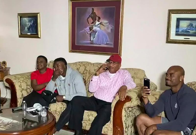 Kenneth Murray, second from left, watches the NFL draft in Missouri City, Texas. NFL / USA TODAY