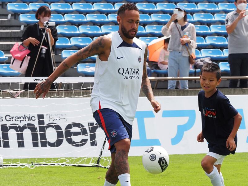 Paris Saint-Germain player Neymar passes a ball. AFP