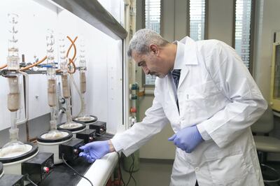 AL AIN, UNITED ARAB EMIRATES - NOV 6:

Emad El-Najjar, Mechanical Engineering Department; stand by the distilling station at UAE University lab, where he's part of a research team that investigates the utilization of date pits to produce biodiesel. 

(Photo by Reem Mohammed/The National)

Reporter: Daniel Bardsley
Section: NA