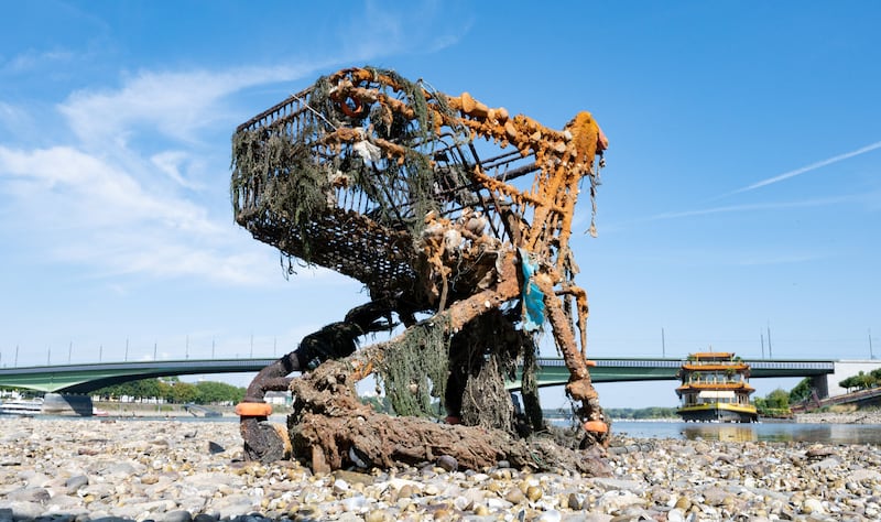 A rusted shopping cart in the Rhine exposed by the low tide in Bonn, Germany. Reuters