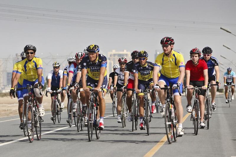 Former Tour de France winner Alberto Contador, fourth from right, visited Dubai on Tuesday and hit the road to ride with some of the area's cycling enthusiasts. Lee Hoagland / The National
