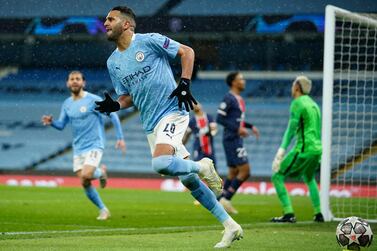 Manchester City's Riyad Mahrez celebrates after scoring his sides second goal during the Champions League semifinal second leg soccer match between Manchester City and Paris Saint Germain at the Etihad stadium, in Manchester, Tuesday, May 4, 2021. (AP Photo/Dave Thompson)