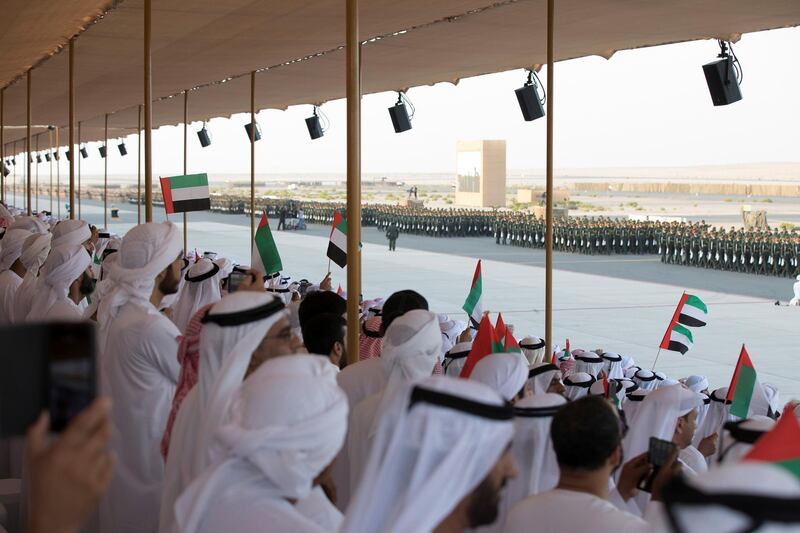 ZAYED MILITARY CITY, ABU DHABI, UNITED ARAB EMIRATES - November 28, 2017: Guests and family members watch the parade during the graduation ceremony of the 8th cohort of National Service recruits and the 6th cohort of National Service volunteers at Zayed Military City. 

( Boris Dejanovic for the Crown Prince Court - Abu Dhabi  )
---