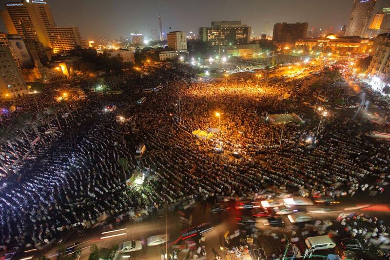 Thousands of Egyptians pray during a rally in Tahrir Square, birthplace of the uprising that ousted Hosni Mubarak 18 months ago, in Cairo, Egypt, to recite the Quran and support President Mohamed Morsi’s recent decision to retire the defense minister and chief of staff.  Amr Nabil / AP Photo