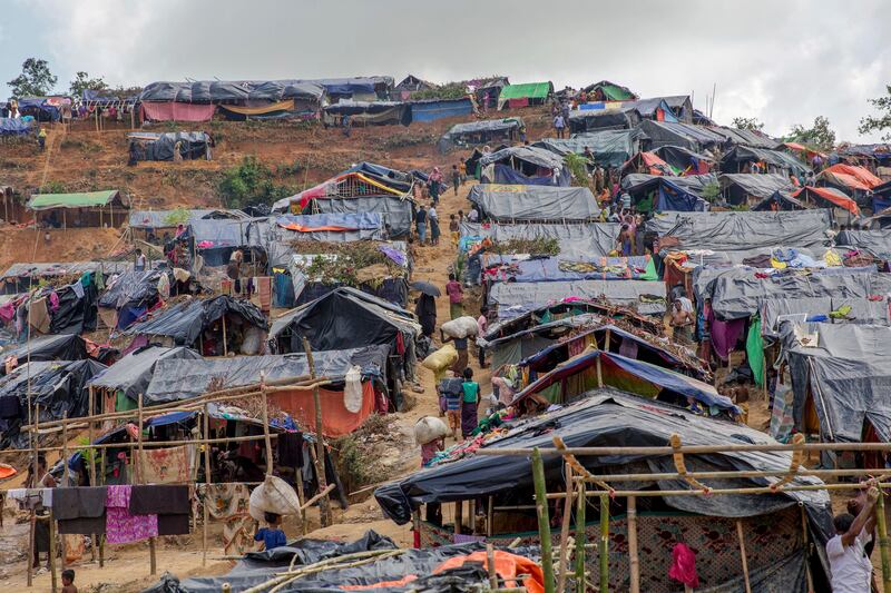 Newly set up tents cover a hillock at a refugee camp for Rohingya Muslims who crossed over from Myanmar into Bangladesh, in Taiy Khali, Bangladesh, Friday, Sept. 22, 2017. More than 420,000 Rohingya refugees have fled from Myanmar to Bangladesh in less than a month, with most ending up in camps in the Bangladeshi district of Cox's Bazar, which already had hundreds of thousands of Rohingya refugees who had fled prior rounds of violence in Myanmar. (AP Photo/Dar Yasin)
