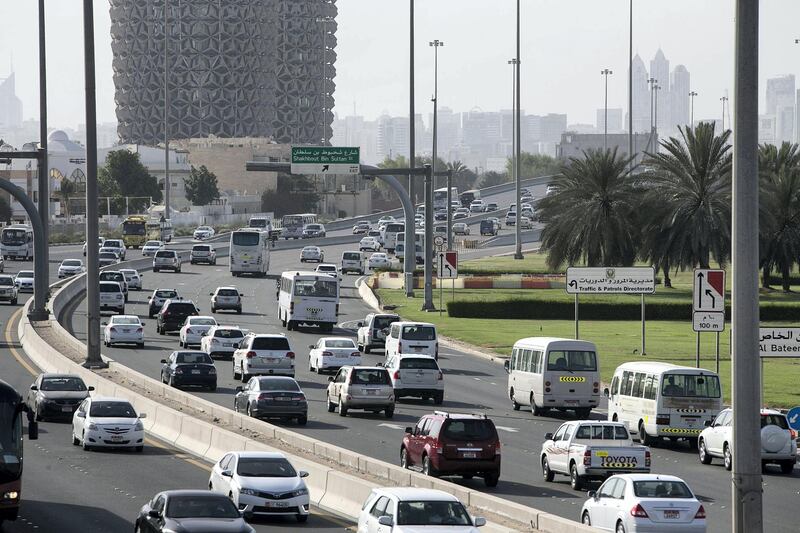 ABU DHABI, UNITED ARAB EMIRATES, May 13, 2015:  
Cars flow in thickening traffic on Sheikh Zayed road in Abu Dhabi during the beginning of rush hour on Wednesday, May 13, 2015. A recent yougov survey-it says commute times in Abu Dhabi are down, and drivers are happier, but the roads still have a lot of inattentive drivers. (Silvia Razgova / The National)  (Usage: May 13, 2015, Section: NA, Reporter: ) *** Local Caption ***  SR-150513-traffic19.jpg