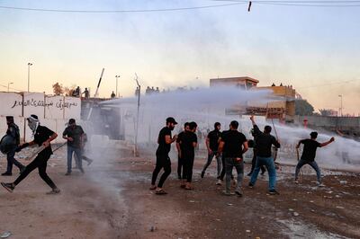 Iraqi riot police used water cannon to disperse protesters who stormed Sweden's embassy in Baghdad. AFP 