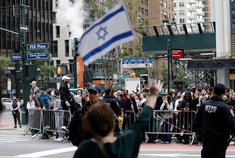 Israeli and Palestinian supporters on opposite sides of 42nd Street in New York. EPA