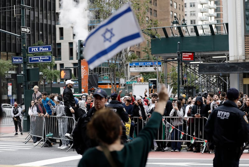 Israeli and Palestinian supporters on opposite sides of 42nd Street in New York. EPA