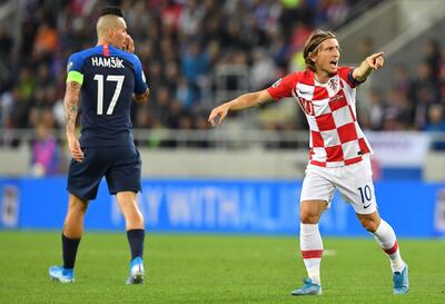 Croatia's captain Luka Modric reacts next to Slovakia's captain Marek Hamsik during the UEFA Euro 2020 qualification football match between Slovakia and Croatia in Trnava, Slovakia on September 6, 2019.  / AFP / JOE KLAMAR
