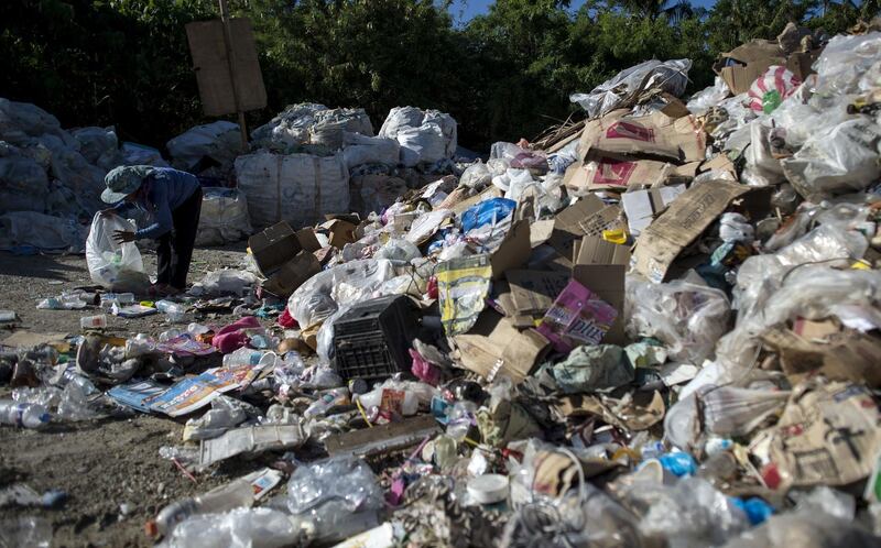 Gina Galan, 45, collects plastic bottles on the Boracay dumpsite called "materials recovery facility (MRF)" in the Philippine island of Boracay on April 25, 2018. Noel Celis / AFP