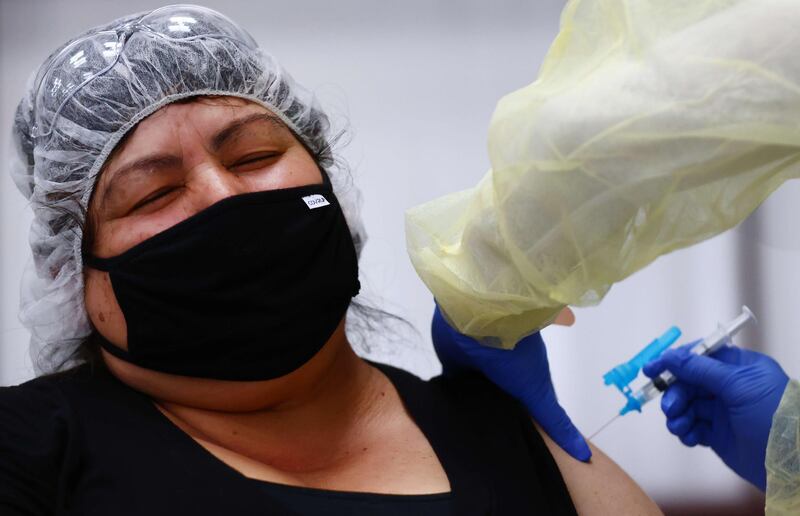 A woman receives a one-shot dose of the Johnson & Johnson Covid-19 vaccine at a clinic in Riverside, California. AFP