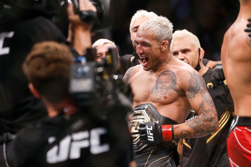 Charles Oliveira reacts after defeating Dustin Poirier by submission in a lightweight mixed martial arts title bout at UFC 269. AP Photo